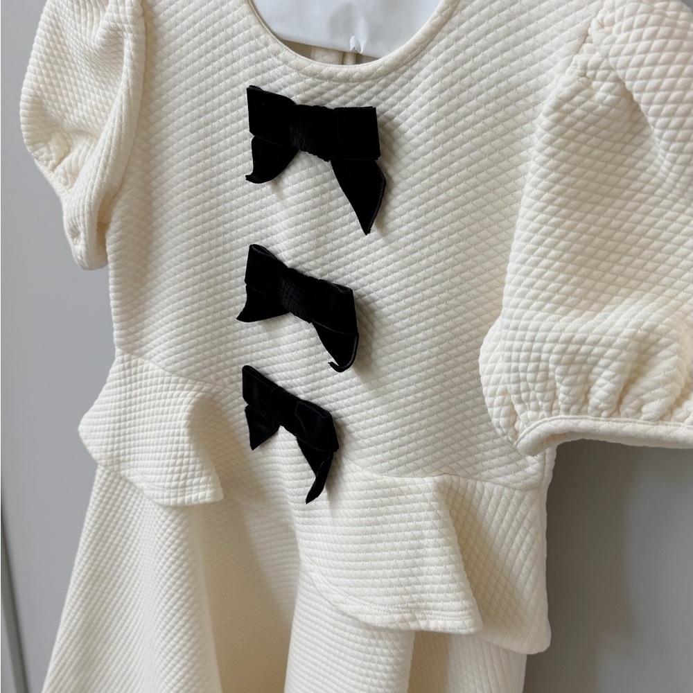 Janie and Jack Cream Peplum Dress with Black Bow Details - Picture 2 of 6